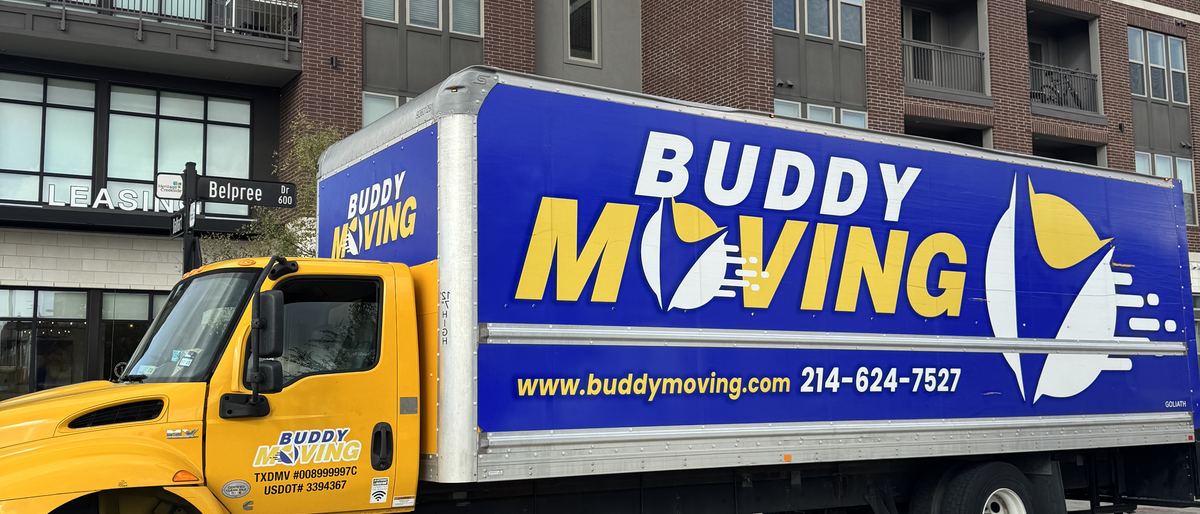 A Buddy Moving truck at a Dallas apartment building