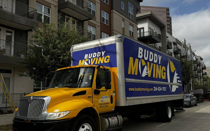 A loaded dolly at a Dallas apartment building
