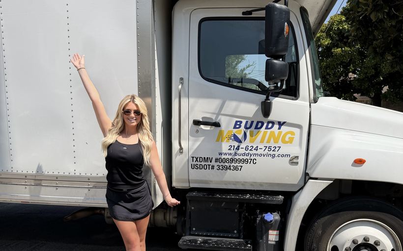 A Buddy Moving crew in front of one of our trailers