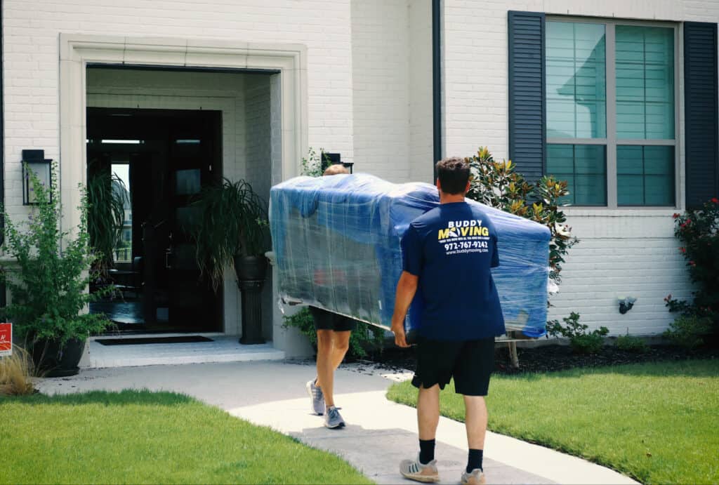 Buddy Moving team carefully taking out the furniture packed with care.